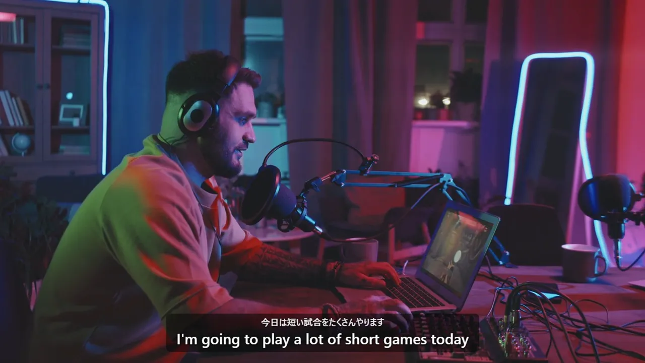 A streamer at a gaming desk, with English subtitles over the video