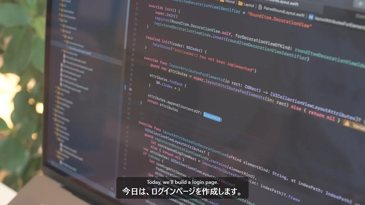 コードを書いている人の映像の上に、日本語字幕が出ている